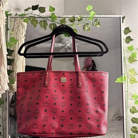 fake red mcm bag|mcm black bag with red.